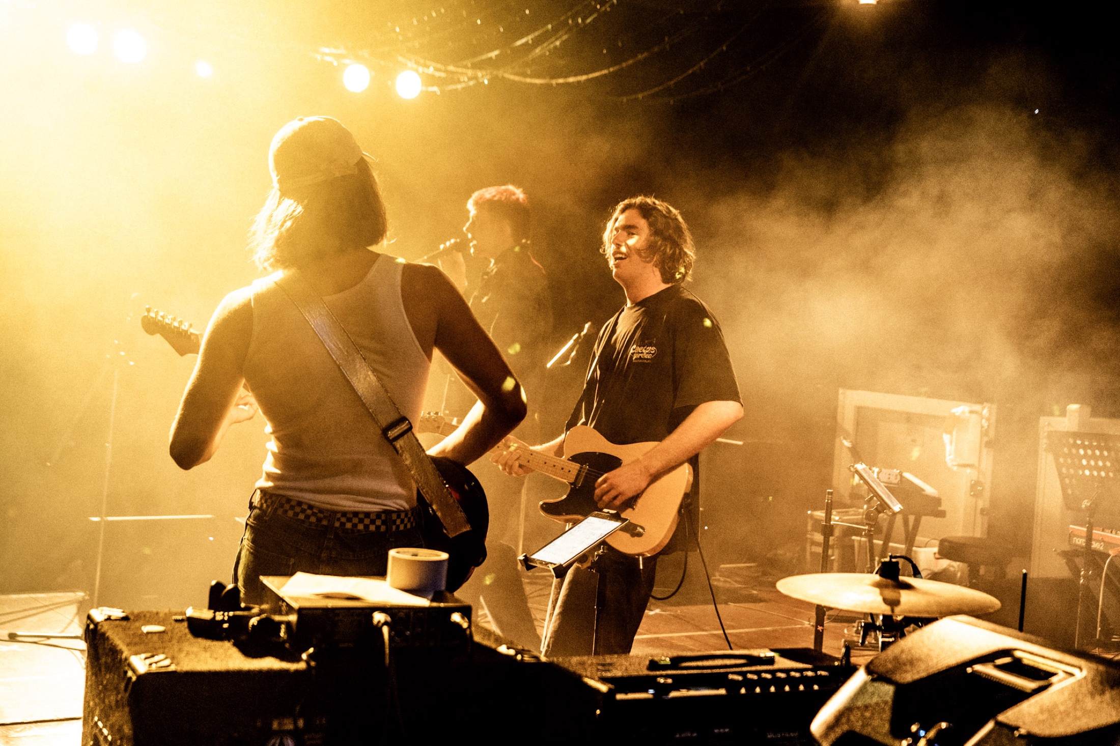 Kai Rennie and band in golden stage light